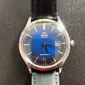 Mens 41mm Orient Bambino automatic blue with black leather band. Excellent.
